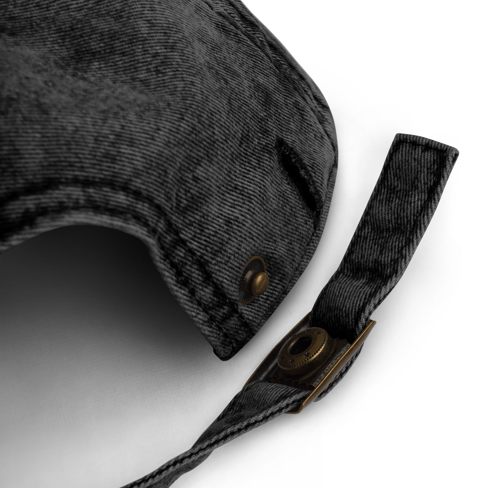 Close-up of the adjustable strap on the Cranky vintage dad hat, featuring an antique brass buckle.