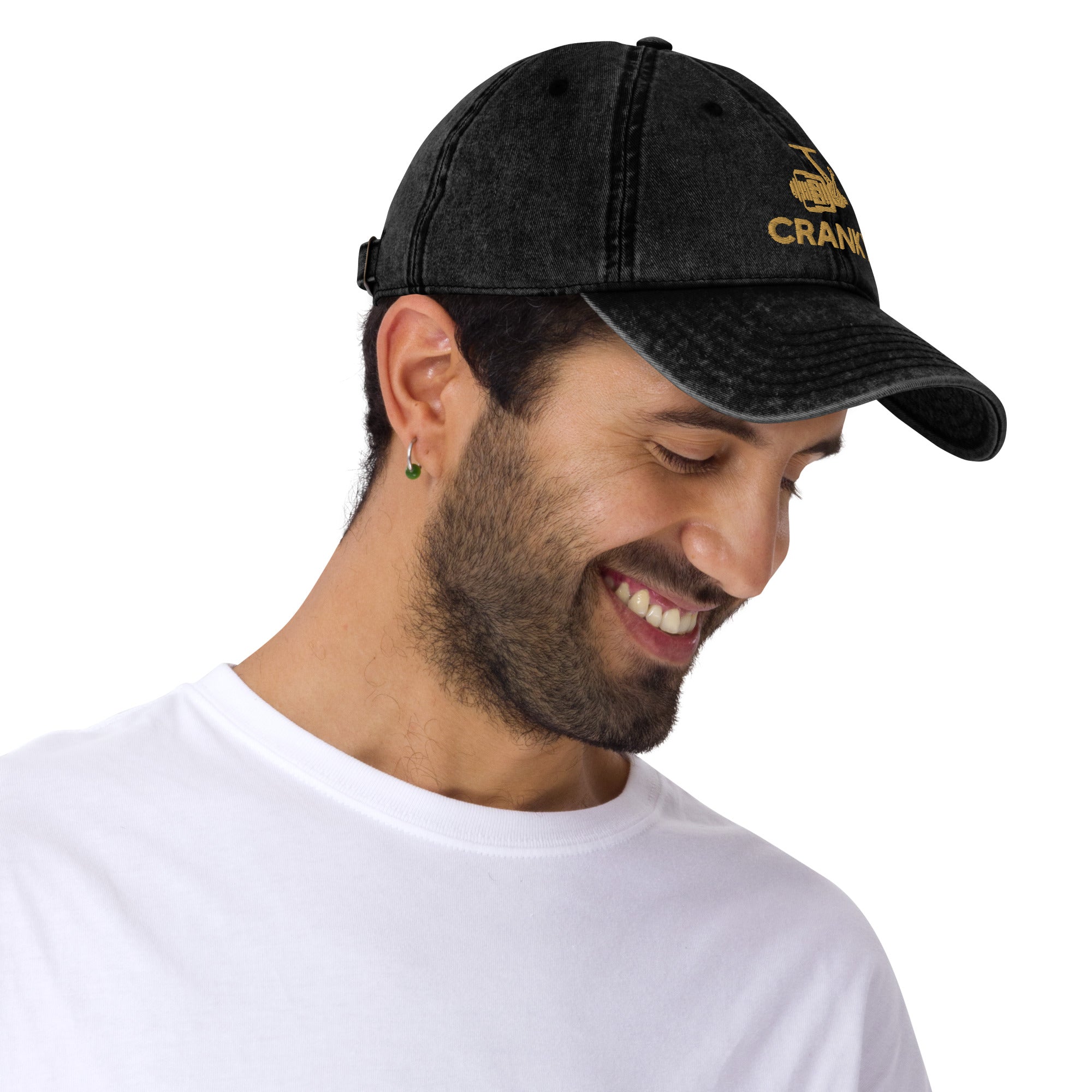 Man wearing the black Cranky vintage dad hat with a rustic fishing reel print – stylish and comfortable for anglers.